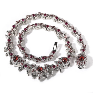 Gothic punk necklace with silver spikes, red devil eyes and thorn-shaped chain links
