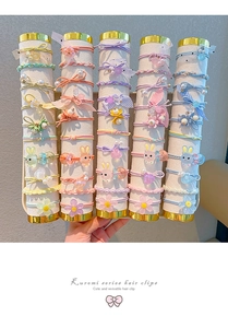 Macro shot of colorful high-elastic hair ties for girls with floral and bunny charms