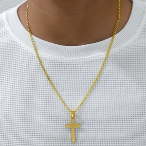 Minimalist gold titanium steel cross pendant necklace worn on a person for a stylish look