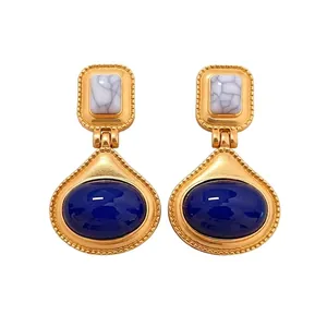 Vintage gold oval resin earrings with blue cabochon and marble stone inlay details