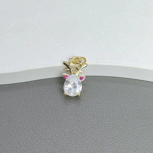 Detail of gold reindeer pendant with teardrop zircon and pink stones for DIY necklaces