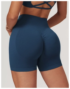 Detail showing high-waist seamless compression and scrunch butt design on navy yoga shorts