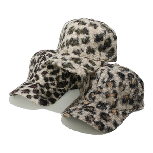 Three leopard print faux fur baseball hats in brown, green, and purple autumn styles