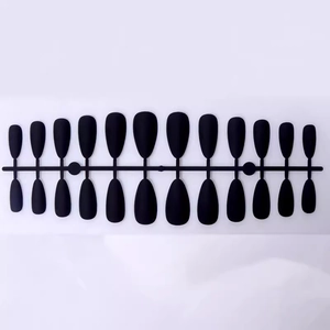 Set of 24 matte black almond press-on nails in various sizes on a clean white background