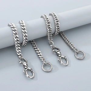 Detail of silver skull link chain for jeans featuring heavy punk style metal rings