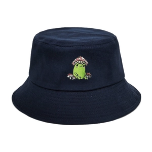 Navy blue bucket hat with embroidered frog and mushroom on a clean white background