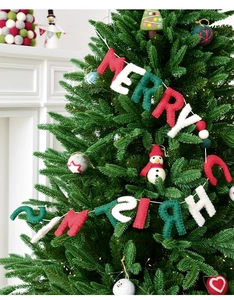 Detail of wool felt Merry Christmas banner letters with fine stitching and handmade texture
