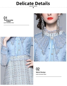 Detail of blue tweed dress with lace collar, ruffles and rhinestone brooch detail