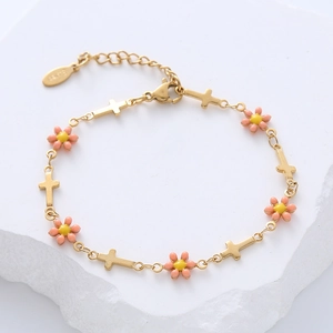 Detail of 18k gold plated stainless steel bracelet with cross charm and pink flower