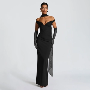 Detail of elegant black off-shoulder mesh dress with pleated waist and long flowing streamer