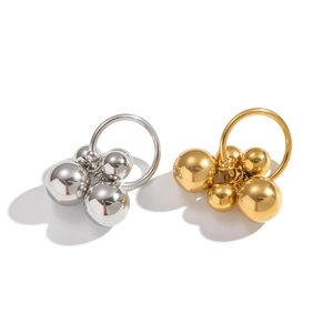 Polished gold and silver stainless steel geometric bead rings in a minimalist punk style