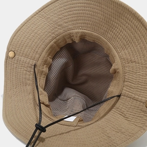 Detail of khaki sun hat featuring breathable mesh lining and adjustable chin strap