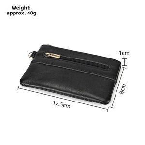Detail view of black crazy horse leather coin purse with dimensions 12.5x8x1cm and 40g weight