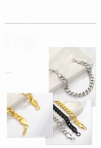 Detail view of curb chain bracelets in gold, silver, and black finishes with lobster clasps