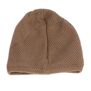 Detailed close-up of brown knit beanie showing waffle texture and ribbed edge