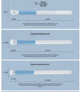 Detail of nose shadow and eyeshadow brushes with blue and white handles and soft bristles