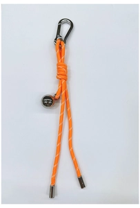 Detail of orange braided nylon keychain with silver metal ball and carabiner hook