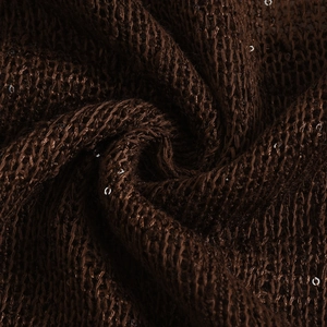Macro shot of brown knitted fabric with sparkling sequins for V-neck halter top