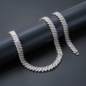 Macro shot of silver hip hop Cuban link chain with detailed CZ stone pavé setting
