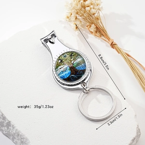 Silver bottle opener nail clipper keychain with tree of life design and size specs