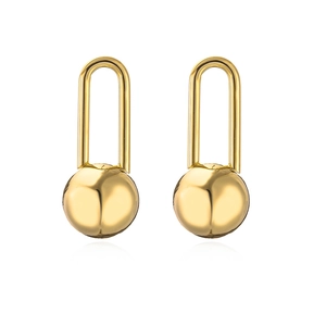 Minimalist punk style gold U-shaped metal earrings with spherical ball pendants on white background