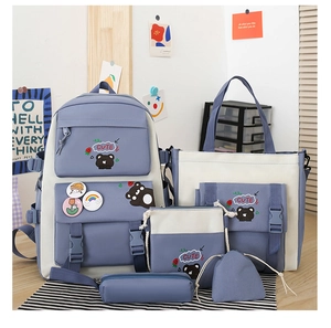 Detailed set of five light blue school bags with cute cartoon bear prints and patterns