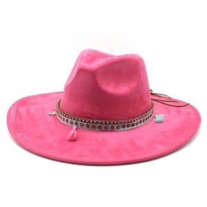 Close-up of pink wide brim felt hat with bohemian embroidered band and colorful tassels