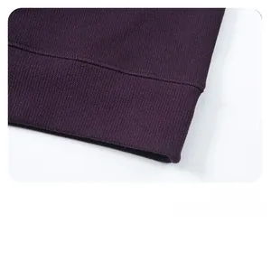 Close-up of the purple sweatshirt ribbed hem showing high-quality knitting craftsmanship