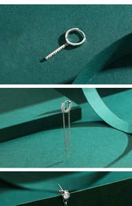 Detailed view of silver long tassel earrings featuring colorful gemstones and double chains