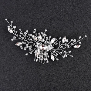 Detailed silver bridal hair comb with emerald green rhinestones and clear crystals