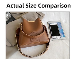 Detailed size comparison of the brown leather bucket bag with a phone and tablet