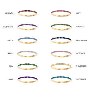 Golden stainless steel birthstone rings set featuring twelve vibrant colored gemstones