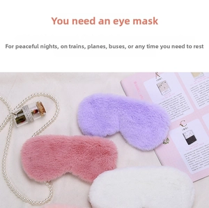 Close-up of soft plush sleep masks in pink, purple and white with decorative pearls