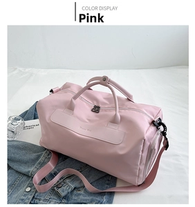 Detailed view of the pink waterproof fitness bag with MISTY BAG logo and sturdy handles
