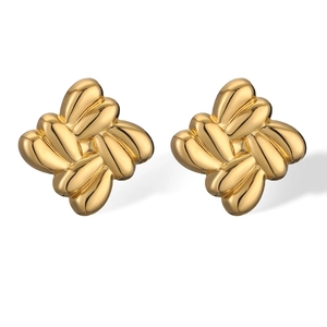 Detailed view of woven knot gold earrings with a polished 3D metallic texture finish