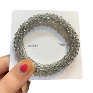 Sparkling smoky grey crystal bead hair tie with multi-faceted reflective finish