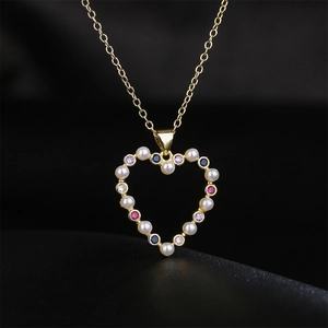 18K gold plated heart pendant necklace with pearls and colorful zircons on black background