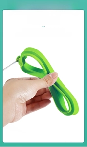 Flexible green silicone fried egg mold showing strong elasticity and non-deformable material