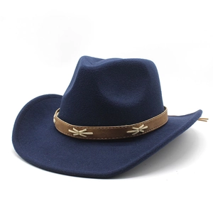 Close-up of dark blue wool felt cowboy hat with brown faux leather braided band