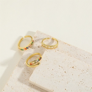 Set of three vintage gold adjustable moon crescent rings with colorful zircon gems