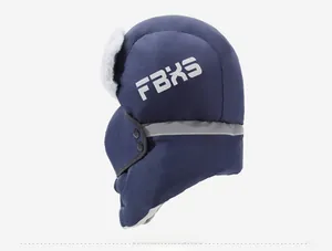 Detail view of winter earflap hat with thick plush lining and reflective safety strip