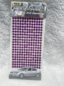 Macro shot of 3mm purple acrylic rhinestones stickers for DIY car and craft decoration