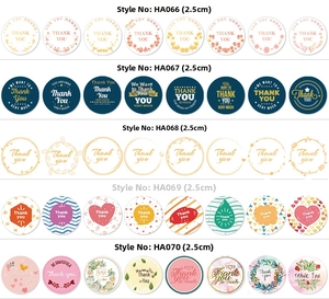 Macro detail of various circular 2.5cm Thank You stickers with floral and geometric designs