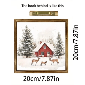Detail of 20x20cm wooden Christmas wall art showing back sawtooth hook and snowy scene