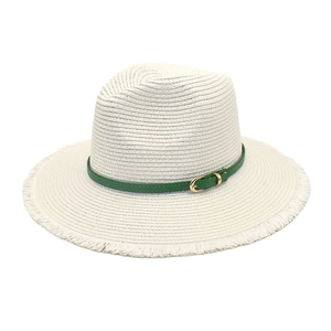 Detail of beige straw fedora featuring a green leather band and fringed brim edges