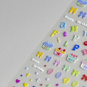 3D embossed nail stickers featuring colorful birthday cake and bow tie designs