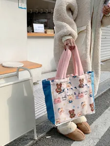 Canvas tote bag with cute cartoon bear print and pink plush handles for daily commute