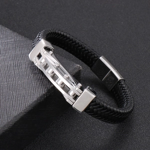 Detail of men's braided leather bracelet with stainless steel industrial style buckle