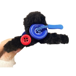 Furry black hair claw clip for women featuring red and blue decorative buttons