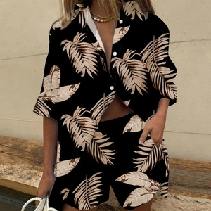 Detail of leaf print short sleeve shirt and shorts set with elastic waist and lapel collar